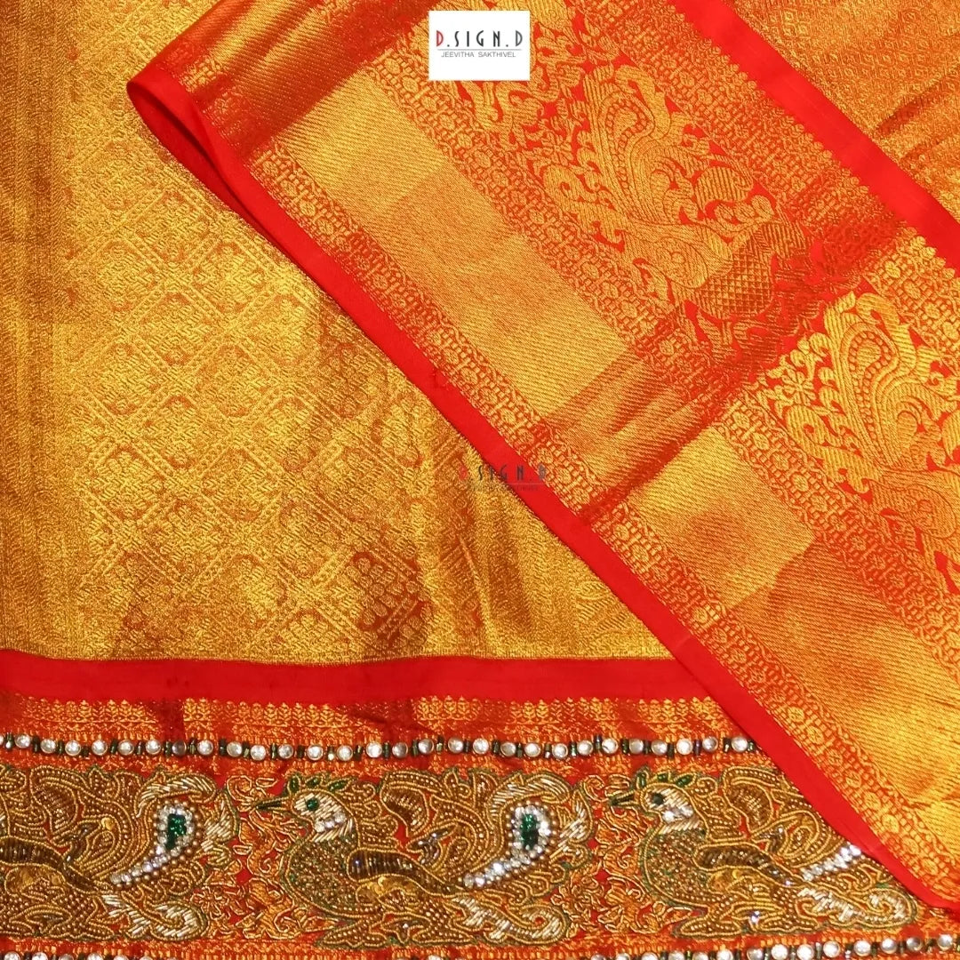 Gold Kanjeevaram embroidered silk saree
