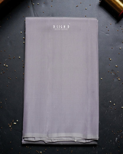 A folded piece of mauve shade shirt material. 