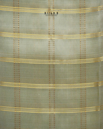 A close-up of a woven fabric with a muted pista green base and horizontal stripes of gold and brown woven dots.