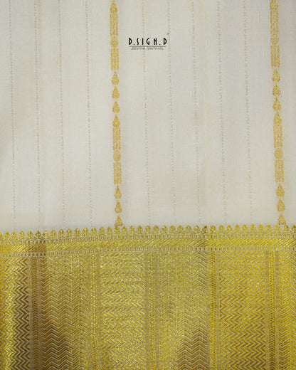 A close-up of a fabric or textile sample with a warm off-white upper section featuring subtle vertical stripes and a wide ornate gold patterned border along the bottom.