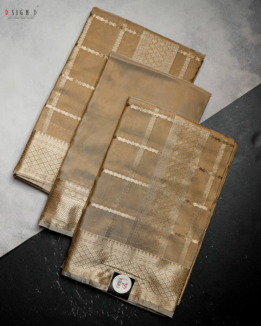 Dark gold Kattam fine silk dhoti set folded to highlight woven check pattern and ornate zari border