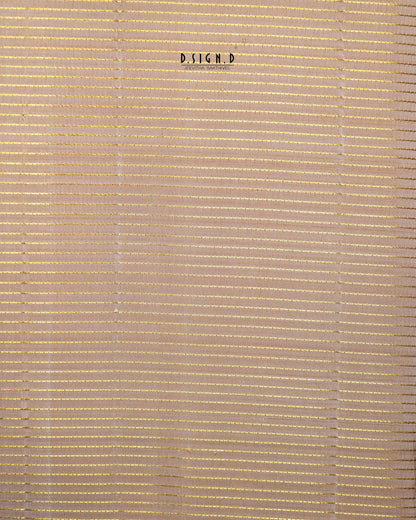 A close-up of a woven or slatted material in a warm beige/tan tone, with thin horizontal and vertical lines creating a textured pattern. 