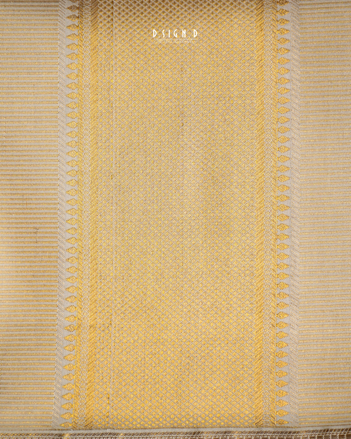 A close-up of a woven textile in pale  beige, showing a textured basketweave pattern with decorative vertical borders and fringe at the bottom. 